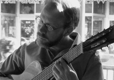 David Newsam playing the guitar.